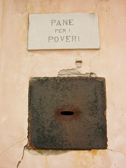 Tafel Pane per i poveri an einer Hauswand in Venedig.